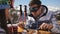 Lunch break at a ski resort. Young couple having lunch in restaurant outdoors in the mountains and communicate with each