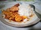 lunch with egg stew and warm rice on the dining table