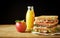 Lunch food set with sandwich, juice and apple