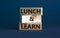 Lunch and learn symbol. Wooden blocks with concept words Lunch and learn. Beautiful grey background, copy space. Business,