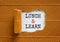 Lunch and learn symbol. Words `Lunch and learn` appearing behind torn brown paper. Beautiful brown background. Business,