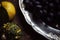 Lunch Provencal style still life on wooden table, flower pattern, seasonal vegetables, wine grapes, pumpkin, daylight.