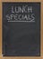 Lunch specials on blackboard in vertical