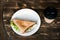 Lunch with triangle sandwich on dark table background top view