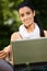 Lunchtime portrait of young woman with laptop