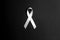 Lung cancer awareness ribbon on black background. November lung cancer awareness month