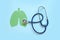 Lung health therapy medical concept . silhouette of the lungs and a stethoscope on a green background. concept of