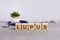 lupus word written on wooden blocks and stethoscope on light gray background