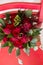Lush bridal Bouquet of red roses and a lot of greenery