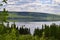 Lush forested landscape casting reflections on Gander Lake