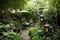 a lush garden with bistro-style seating and lanterns