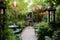 a lush garden with bistro-style seating and lanterns