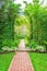 Lush green garden with wrought iron arbor