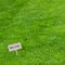 Lush green grass background with Organic sign