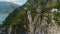 Lush greenery adorns rugged cliffs on Capri Island, Italy. Verdant vegetation on steep rocks, overlooking the tranquil