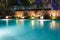 Lush pool lighting in backyard for luxury swimming pool design c