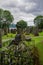 Luss, Scotland: A grave overgrown with mosses and topped with a stone cross