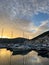 Lustica, Montenegro - 15 august 2023: Sunset behind the mountains over the marina with moored yachts
