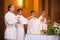 Lutheran priest during communion in worship
