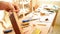 Luthier filing a mastil guitar, close up