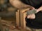 Luthier makes a neck block on classical guitar.