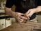 Luthier modifies the head of classical guitar.