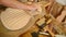 Luthier sanding a guitar in workplace