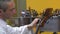 The luthier tune the four strings of cello