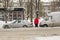 Lutsk, Ukraine - February 12,2020: City street after blizzard. Stuck car in snow and ice. Buried vehicle in snowdrift. Parking in