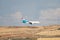 Luxair airline plane, with the landing gear lowered, approaching to land at Madrid Barajas airport.