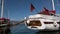 Luxe rich wooden yachts stand on background of blue sky in harbor of Turkey.