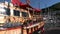 Luxe rich wooden yachts stand on background of blue sky in harbor of Turkey.