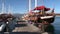 Luxe rich wooden yachts stand on background of blue sky in harbor of Turkey.