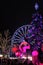 Luxembourg - 2022 Winterlights - A Carousel wheel and violet tree at the Christmas Market