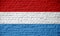 Luxembourg flag, brick wall texture concept