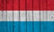 Luxembourg Flag Over Wood Planks