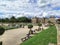 Luxembourg gardens and palace with puffy clouds in Paris, France