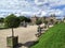 Luxembourg gardens and palace with puffy clouds in Paris, France