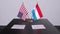 Luxembourg and USA at the negotiating table, a diplomatic deal. Business and politics animation. National flags