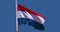 Luxembourgish flag waving in the wind, slow motion