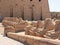 Luxor, Egypt - October 3, 2021: View of the alley of sphinxes in Karnak Temple. The statues are installed in a row near the main