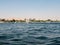 Luxor, Egypt - October 3, 2021: View of the Nile river and the coastline of Luxor. Boats transport people from one bank to the