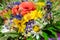 Luxuriant summer bouquet of wildflowers with poppies, daisies, cornflowers closeup.