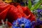 Luxuriant summer bouquet of wildflowers with poppies, daisies, cornflowers closeup.