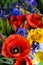 Luxuriant summer bouquet of wildflowers with poppies, daisies, cornflowers closeup.