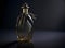 A luxurious antique elegant crystal glass perfume cologne bottle with empty label in gold color. Generative AI