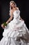 Luxurious bride in wedding dress with a bouquet