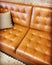 Luxurious brown leather sofa with cushion