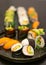 Luxurious and creative Sushi plated as Nigiri, Futomaki, Uramaki and Gunkan