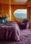 luxurious cruise liner cabin designed with a modern aesthetic. The overall design is chic and contemporary, with a color